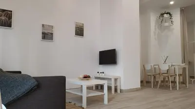 Una televisión o centro de entretenimiento en Suites Jeronimo de Cordoba