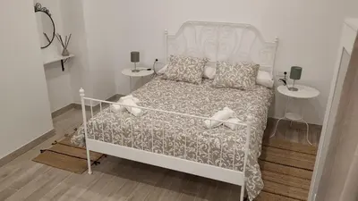 Cama o camas de una habitación en Suites Jeronimo de Cordoba