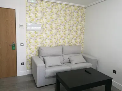 Zona de estar de Apartamentos Las Palmeras