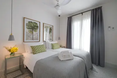 Cama o camas de una habitación en Apartamentos Los Patios de la Judería