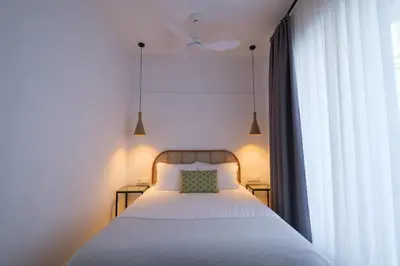 Cama o camas de una habitación en Apartamentos Los Patios de la Judería