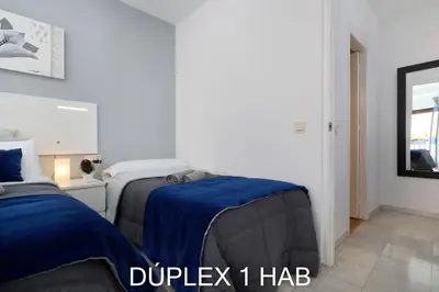Cama o camas de una habitación en Casas Caballerizas Mezquita 1 y 3 HAB