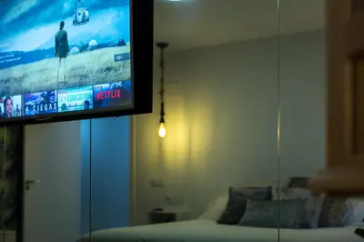 Una televisión o centro de entretenimiento en Alojamiento Deanes 5