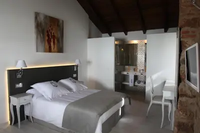 Cama o camas de una habitación en La Casa del Médico Hotel Boutique