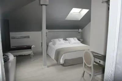 Cama o camas de una habitación en La Casa del Médico Hotel Boutique