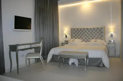 Cama o camas de una habitación en La Casa del Médico Hotel Boutique