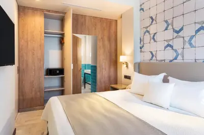 Cama o camas de una habitación en Hotel San Pablo Sevilla