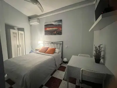 Cama o camas de una habitación en Santa Isabel Low Cost Rooms in private house