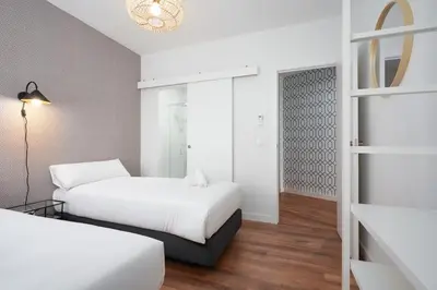Cama o camas de una habitación en SUNN Amador de los Ríos, by Homing U