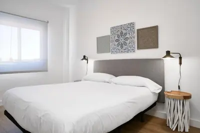 Cama o camas de una habitación en SUNN Amador de los Ríos, by Homing U