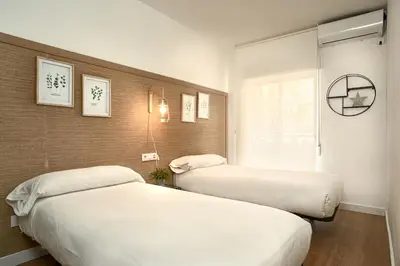 Cama o camas de una habitación en SUNN Amador de los Ríos, by Homing U