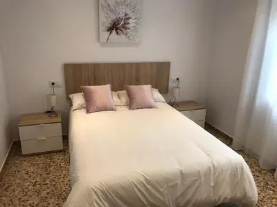 Cama o camas de una habitación en Casa patio ribera de córdoba