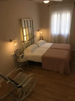 Cama o camas de una habitación en Urban Suites El Postigo