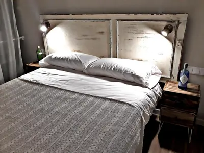 Cama o camas de una habitación en Urban Suites El Postigo