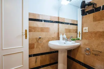 Un baño de Novalia Home Suite 14