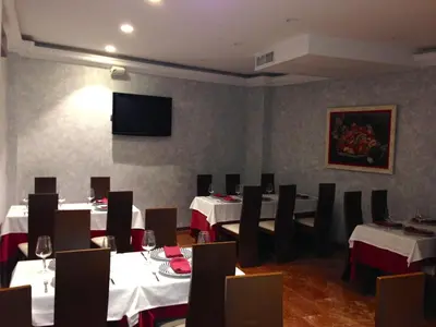 Una televisión o centro de entretenimiento en Hostal el Volao