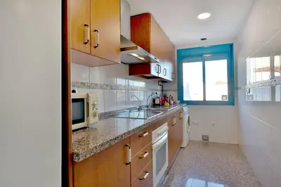 Una cocina o zona de cocina en CONFORT CORDOBA CENTRO II