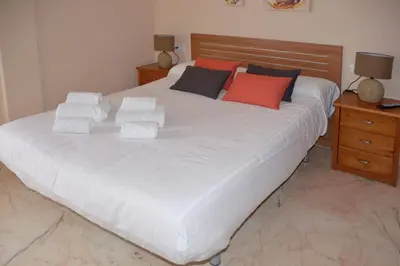 Cama o camas de una habitación en Apartamentos Casa-Patio Las Palmeras