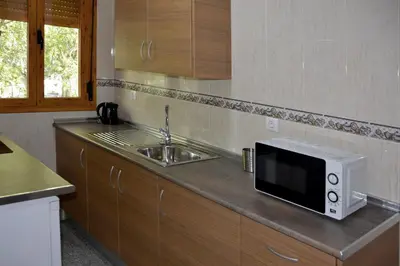 Una cocina o zona de cocina en Apartamentos Casa-Patio Las Palmeras