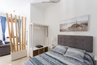 Cama o camas de una habitación en Suites Lumbreras