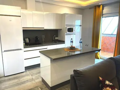 Una cocina o zona de cocina en Apartamentos Cantarería, Azahar