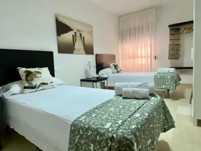 Cama o camas de una habitación en Entrenaranjos Calle Pérez de Castro