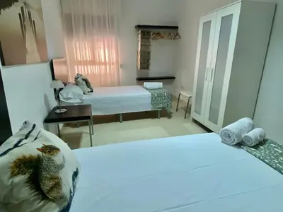 Cama o camas de una habitación en Entrenaranjos Calle Pérez de Castro