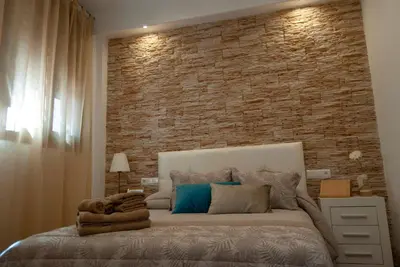 Cama o camas de una habitación en Apartamentos Cantarería, Jazmín.