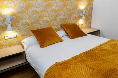Cama o camas de una habitación en Apartamentos en Córdoba, Puente Romano y Torre Calahorra