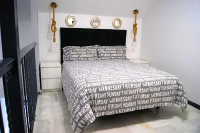 Cama o camas de una habitación en Fabuloso Loft en Centro Histórico de Córdoba con Parking bajo reserva Tendillas Mezquita-Catedral