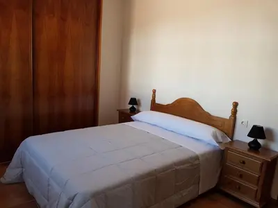 Cama o camas de una habitación en Apartamentos Rurales La Dehesa del Acebuche