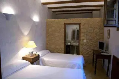 Cama o camas de una habitación en Hospedería del Monasterio