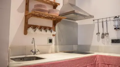 Una cocina o zona de cocina en Apartamento El Teatro