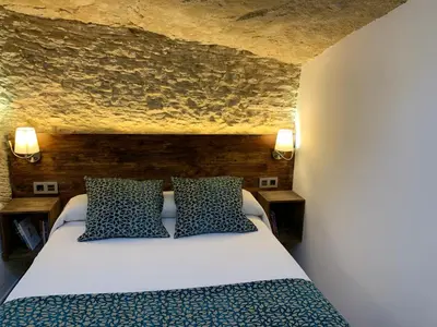 Cama o camas de una habitación en Casa Cueva El Puente