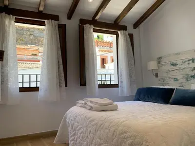 Cama o camas de una habitación en Casa Cueva El Puente