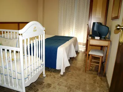 Cama o camas de una habitación en Hotel Al-Yussana