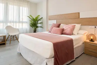 Cama o camas de una habitación en Viviendas con Fines Turísticos 