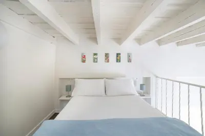 Cama o camas de una habitación en Alohamundi Alameda