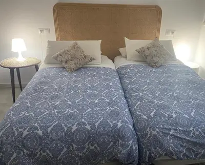 Cama o camas de una habitación en El nido del Chorro