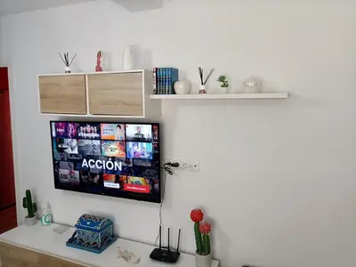 Una televisión o centro de entretenimiento en Apartamento San Antón
