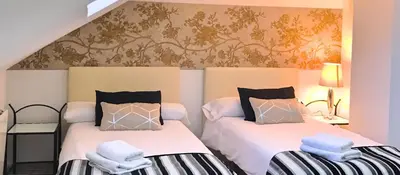 Cama o camas de una habitación en FUENTE REDONDA EN BAEZA