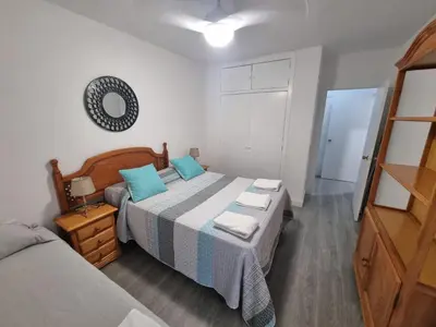 Cama o camas de una habitación en Vivienda Turística Acogedora en los Patios de San Basilio