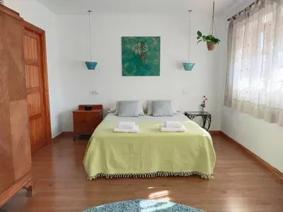 Cama o camas de una habitación en Preciosa casa grande con patio en Sevilla 8PAX
