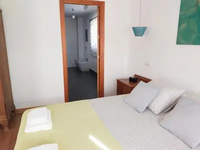 Cama o camas de una habitación en Preciosa casa grande con patio en Sevilla 8PAX