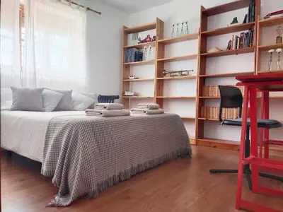 Cama o camas de una habitación en Preciosa casa grande con patio en Sevilla 8PAX