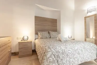 Cama o camas de una habitación en Pasaje de amores der Descanso en casa y vida cultural y monumentos 2px