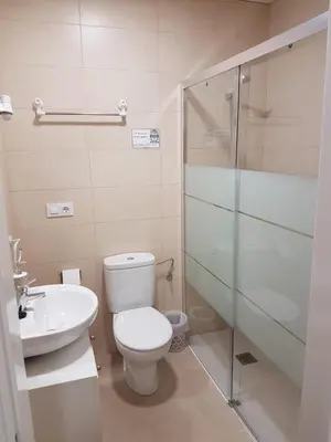 Un baño de Apartamentos HELA