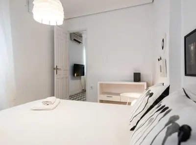 Cama o camas de una habitación en Alhóndiga Suite Apartment with Terrace