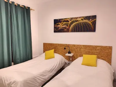 Cama o camas de una habitación en La Casa de Pedro Verdugo Apartamento Turístico