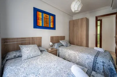 Cama o camas de una habitación en Sevilla Sol